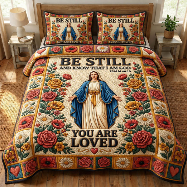 Mother Mary quilted 3-piece bedding set on a made bed with two matching pillow shams
