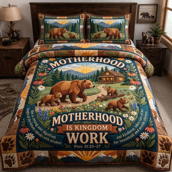 Motherhood Is Kingdom Work quilted 3-piece bedding set on a made bed with two matching pillow shams