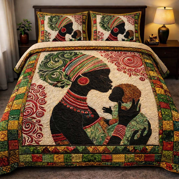 Motherhood Tribal Bond quilted 3-piece bedding set on a made bed with two matching pillow shams
