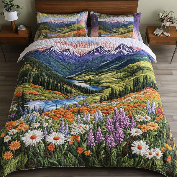 Mountain Bloom Valley quilted 3-piece bedding set on a made bed with two matching pillow shams