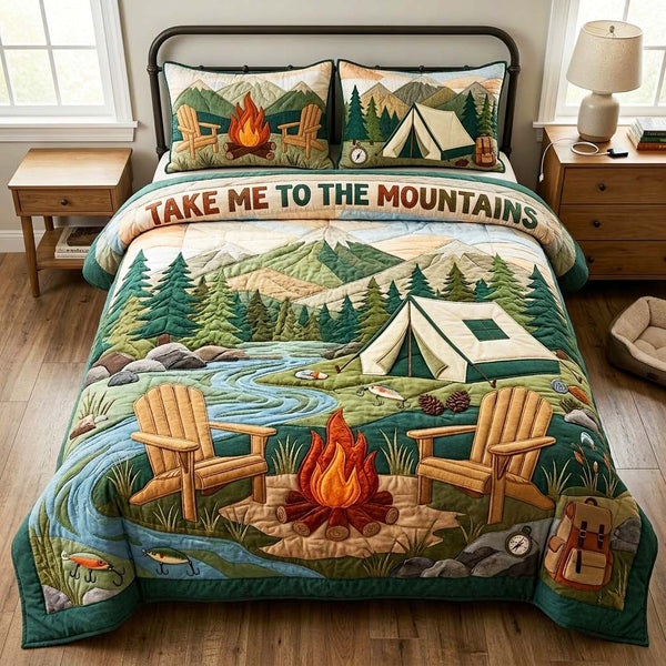 Mountain Campfire quilted 3-piece bedding set on a made bed with two matching pillow shams
