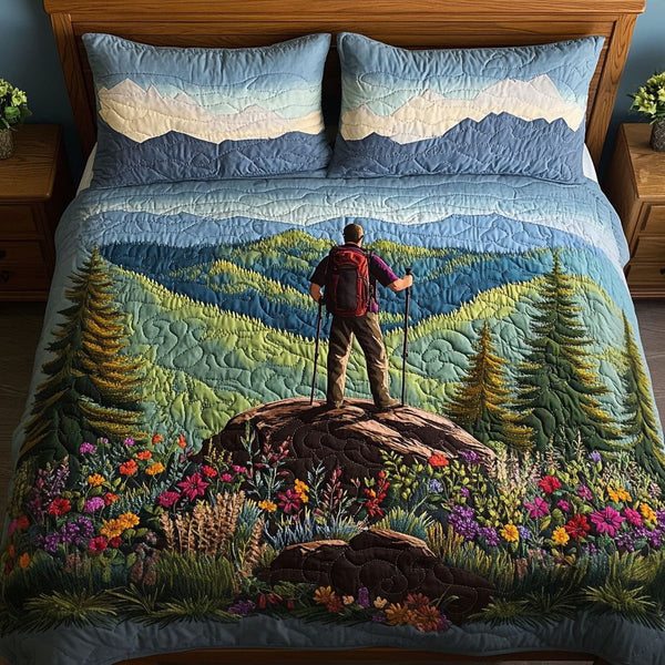 Mountain Expedition quilted 3-piece bedding set on a made bed with two matching pillow shams