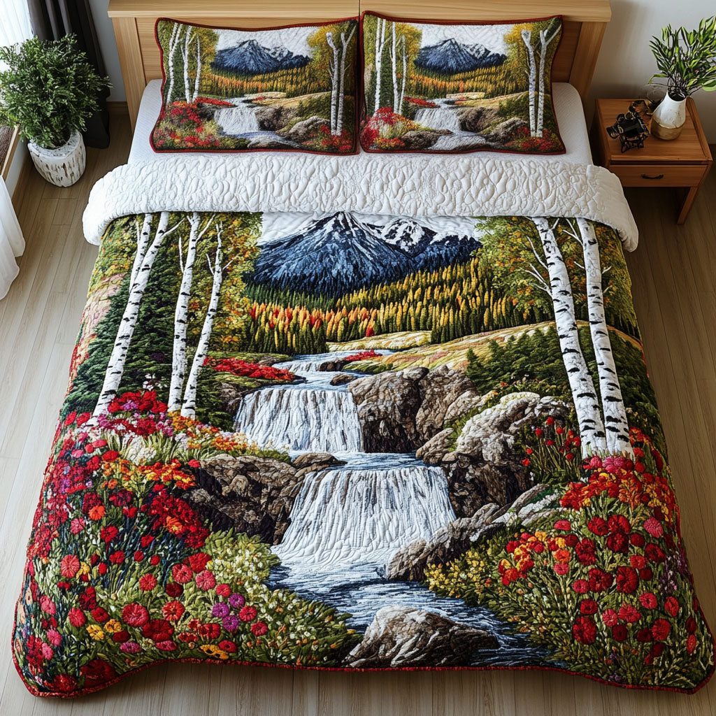 Mountain Falls Retreat quilted 3-piece bedding set on a made bed with two matching pillow shams