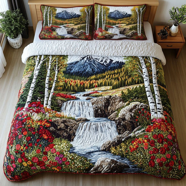 Mountain Falls Retreat quilted 3-piece bedding set on a made bed with two matching pillow shams