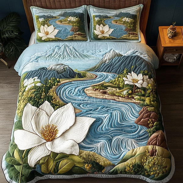 Mountain Floral quilted 3-piece bedding set on a made bed with two matching pillow shams