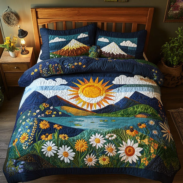 Mountain Glow quilted 3-piece bedding set on a made bed with two matching pillow shams