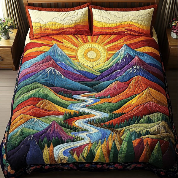 Mountain Glow quilted 3-piece bedding set on a made bed with two matching pillow shams