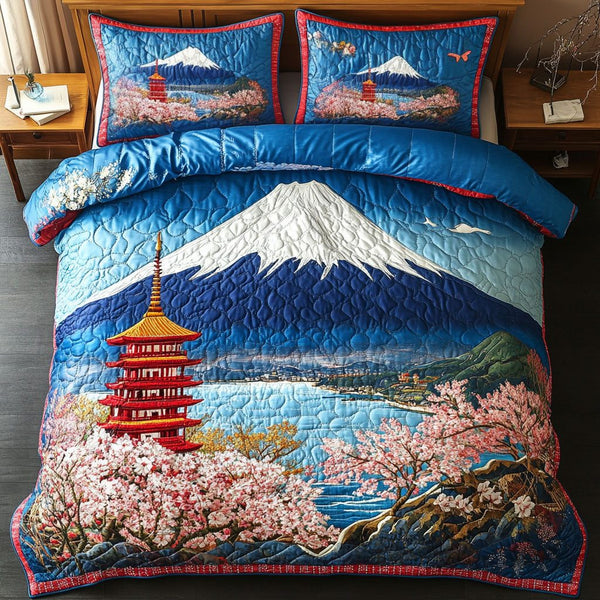 Mountain Muse quilted 3-piece bedding set on a made bed with two matching pillow shams