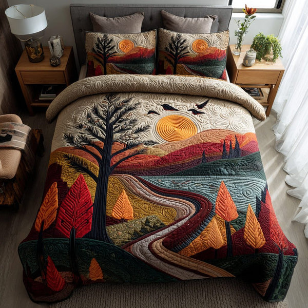 Mountain River Sunrise quilted 3-piece bedding set on a made bed with two matching pillow shams