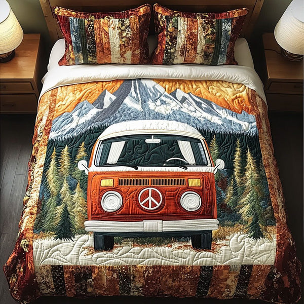 Mountain Road Trip quilted 3-piece bedding set on a made bed with two matching pillow shams
