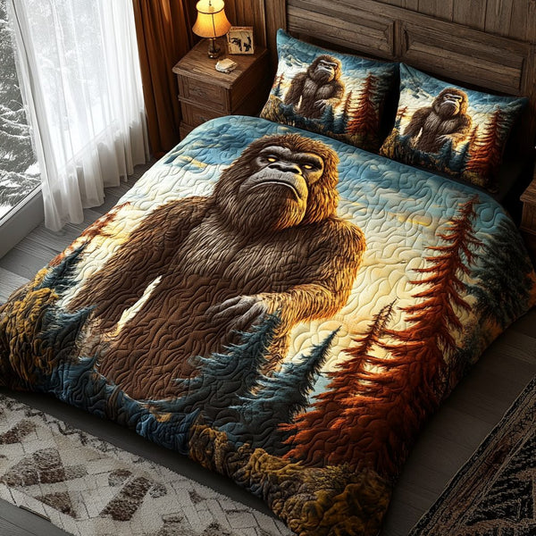 Mountain Sentinel quilted 3-piece bedding set on a made bed with two matching pillow shams