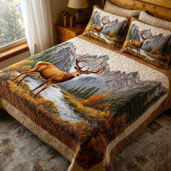 Mountain Serenity quilted 3-piece bedding set on a made bed with two matching pillow shams