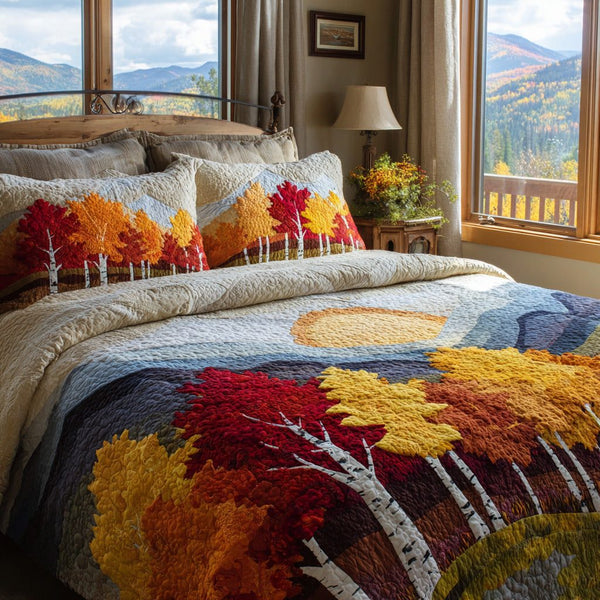 Mountain Sunrise quilted 3-piece bedding set on a made bed with two matching pillow shams
