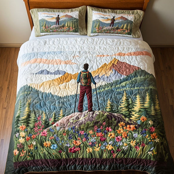 Mountain View Trek quilted 3-piece bedding set on a made bed with two matching pillow shams
