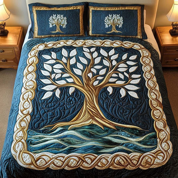 Mystic Arbor quilted 3-piece bedding set on a made bed with two matching pillow shams