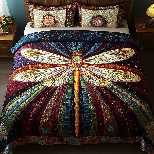 Mystic Dragonfly quilted 3-piece bedding set on a made bed with two matching pillow shams