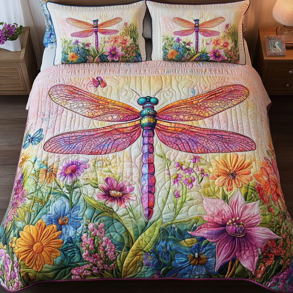 Mystic Dragonfly quilted 3-piece bedding set on a made bed with two matching pillow shams