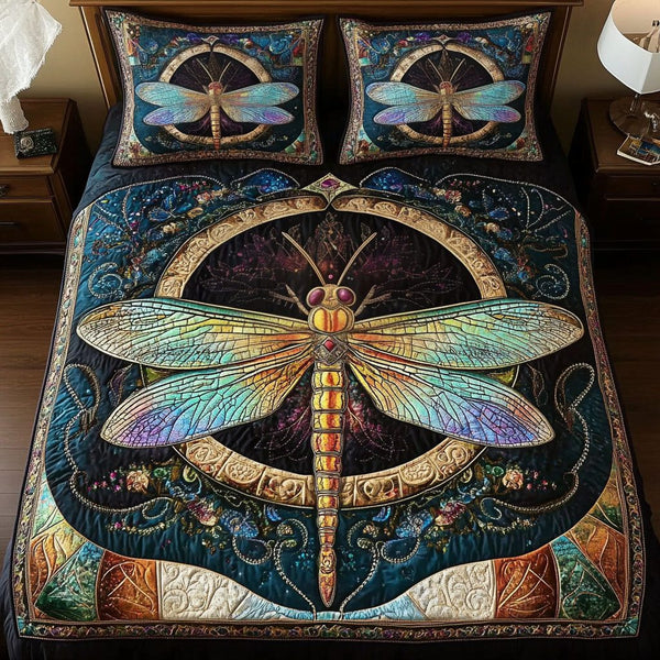 Mystic Dragonfly quilted 3-piece bedding set on a made bed with two matching pillow shams