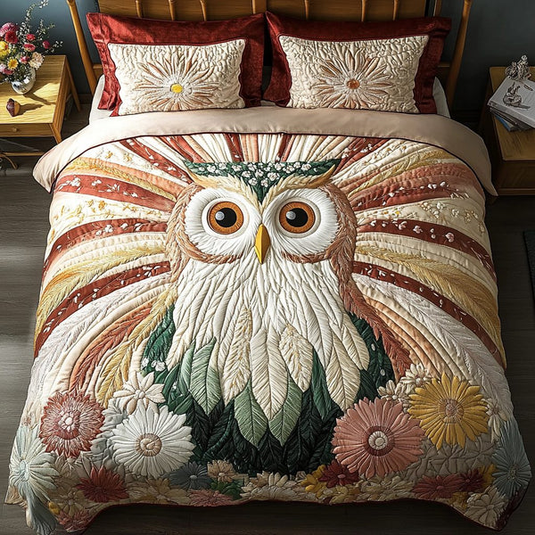 Mystic Feathers quilted 3-piece bedding set on a made bed with two matching pillow shams