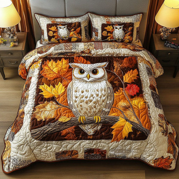 Mystic Feathers quilted 3-piece bedding set on a made bed with two matching pillow shams