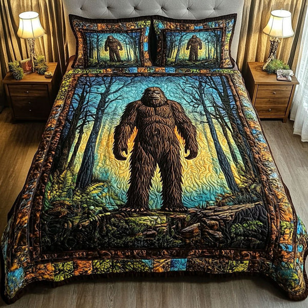 Mystic Forest quilted 3-piece bedding set on a made bed with two matching pillow shams
