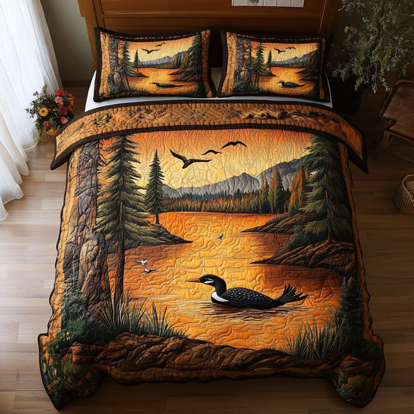 Mystic Loon quilted 3-piece bedding set on a made bed with two matching pillow shams