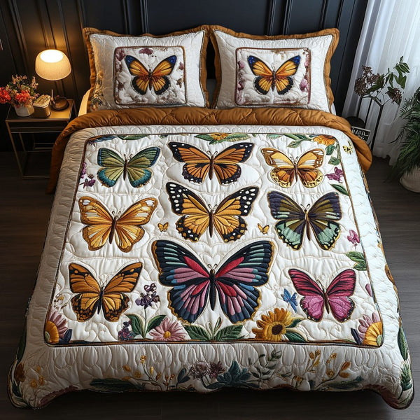 Mystic Monarch quilted 3-piece bedding set on a made bed with two matching pillow shams