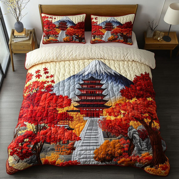 Mystic Red Leaves quilted 3-piece bedding set on a made bed with two matching pillow shams