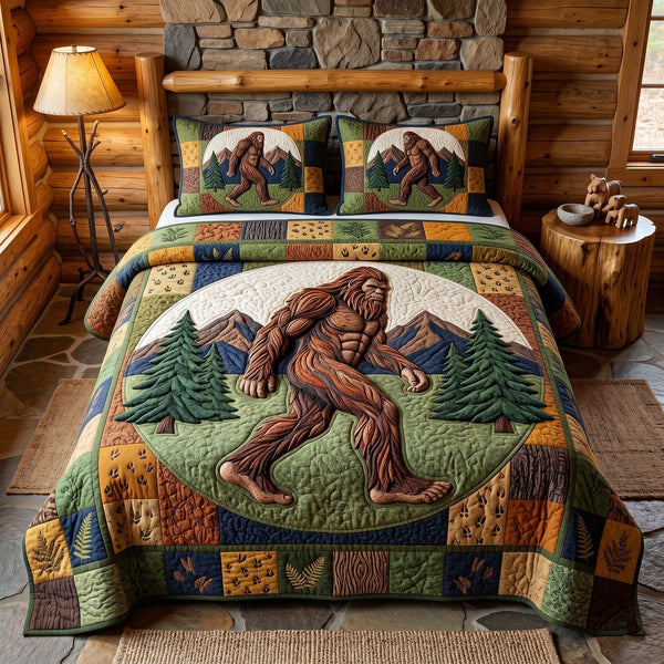 Mystic Sasquatch quilted 3-piece bedding set on a made bed with two matching pillow shams