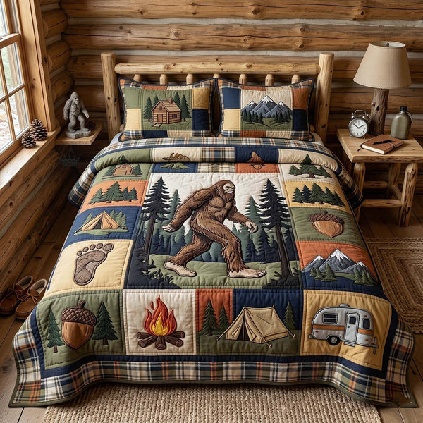 Mystic Sasquatch quilted 3-piece bedding set on a made bed with two matching pillow shams