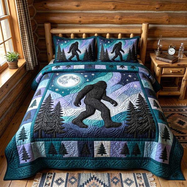 Mystic Sasquatch quilted 3-piece bedding set on a made bed with two matching pillow shams