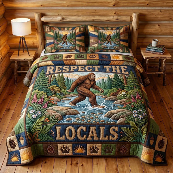 Mystic Sasquatch quilted 3-piece bedding set on a made bed with two matching pillow shams
