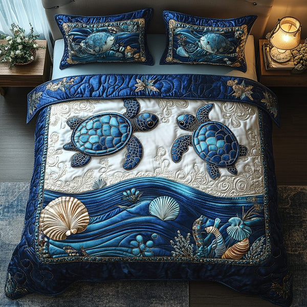 Mystic Tides quilted 3-piece bedding set on a made bed with two matching pillow shams