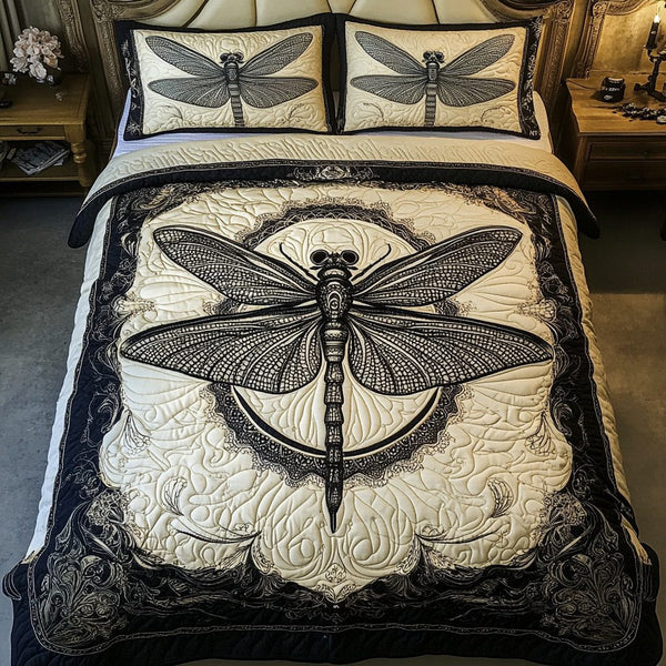Mystic Wings quilted 3-piece bedding set on a made bed with two matching pillow shams