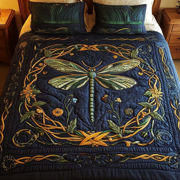 Mystical Dragonfly quilted 3-piece bedding set on a made bed with two matching pillow shams