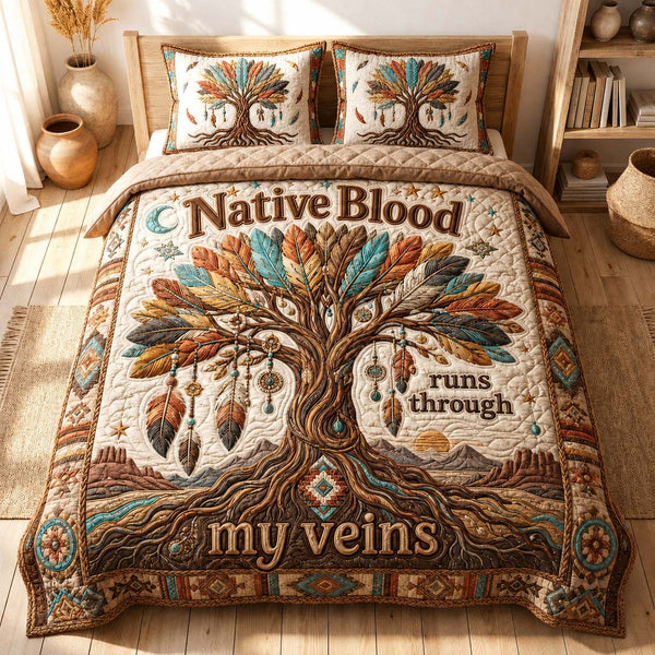 Native Blood Roots quilted 3-piece bedding set on a made bed with two matching pillow shams