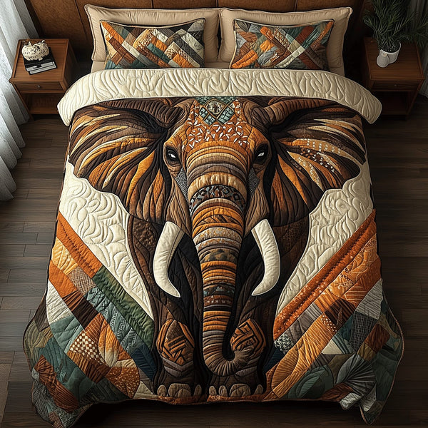 Natural Grace Elephant quilted 3-piece bedding set on a made bed with two matching pillow shams