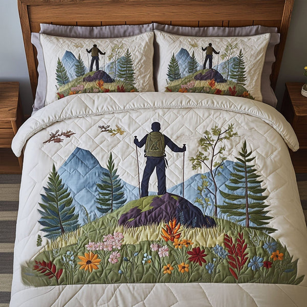 Nature Hike quilted 3-piece bedding set on a made bed with two matching pillow shams