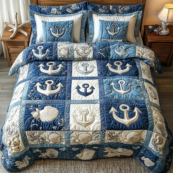 Nautical Anchor quilted 3-piece bedding set on a made bed in a light coastal bedroom