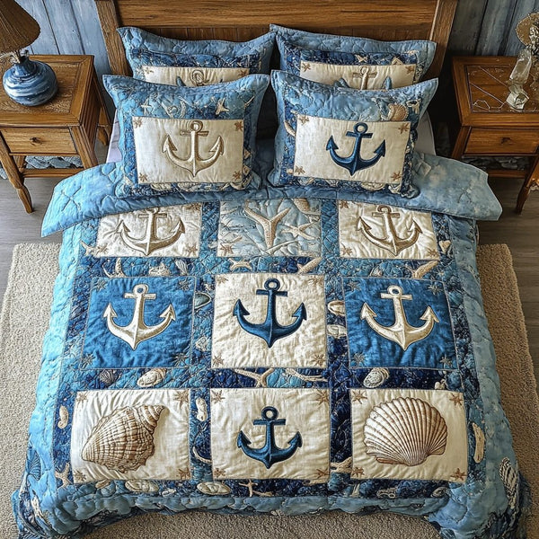 Nautical Anchor quilted 3-piece bedding set on a made bed in a light coastal bedroom