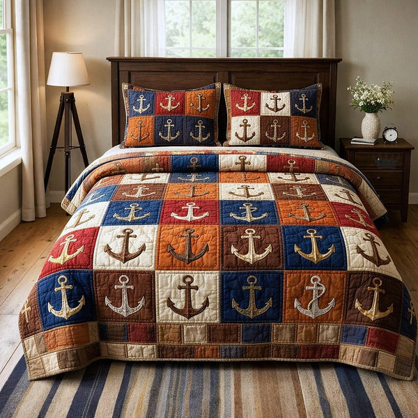 Nautical Anchor quilted 3-piece bedding set on a made bed in a light coastal bedroom