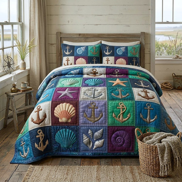 Nautical Anchor quilted 3-piece bedding set on a made bed in a light coastal bedroom