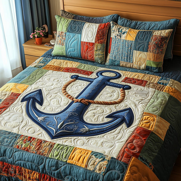 Nautical Anchor quilted 3-piece bedding set on a made bed in a light coastal bedroom