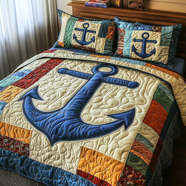 Nautical Anchor quilted 3-piece bedding set on a made bed in a light coastal bedroom