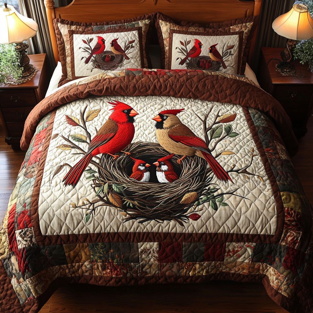 Nesting Cardinals Delight quilted 3-piece bedding set on a made bed with two matching pillow shams