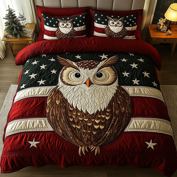 Night Glider quilted 3-piece bedding set on a made bed with two matching pillow shams
