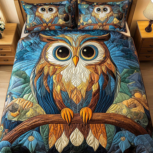 Night Observer quilted 3-piece bedding set on a made bed with two matching pillow shams