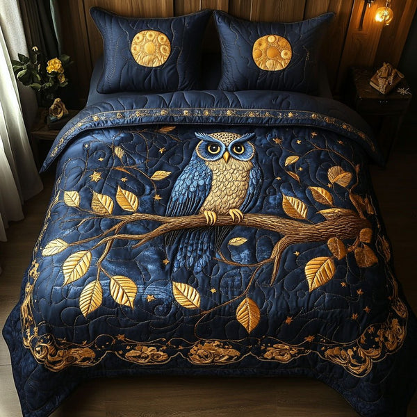 Night Owl quilted 3-piece bedding set on a made bed with two matching pillow shams
