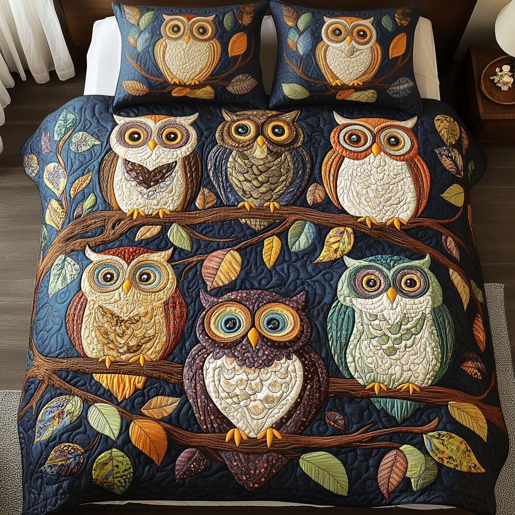 Night Perch quilted 3-piece bedding set on a made bed with two matching pillow shams