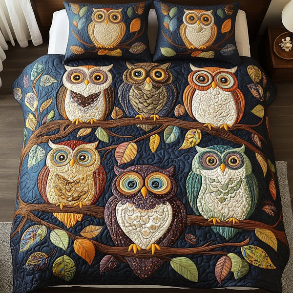 Night Perch quilted 3-piece bedding set on a made bed with two matching pillow shams